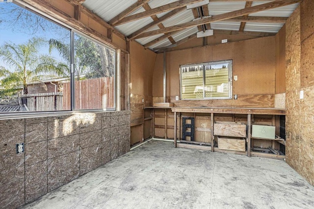 miscellaneous room featuring lofted ceiling with beams