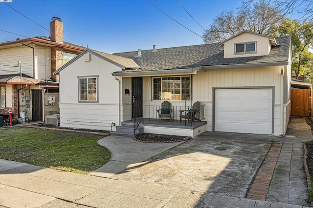 view of front of house with a garage and a porch