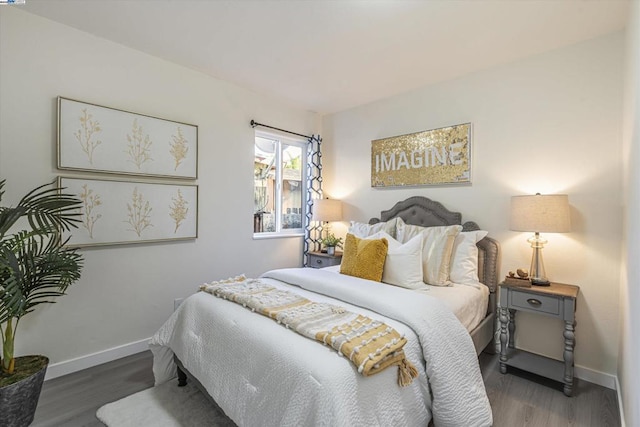 bedroom featuring dark hardwood / wood-style flooring