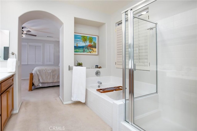 bathroom with vanity, separate shower and tub, and ceiling fan