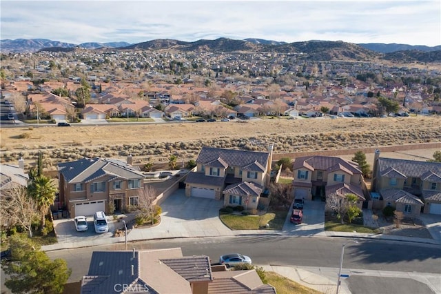 birds eye view of property with a mountain view