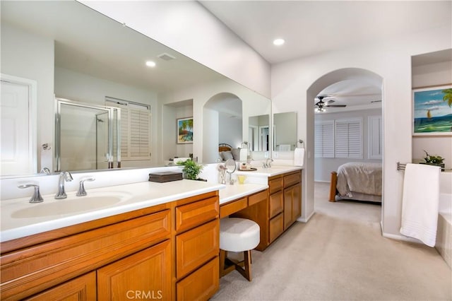 bathroom with vanity, ceiling fan, and walk in shower