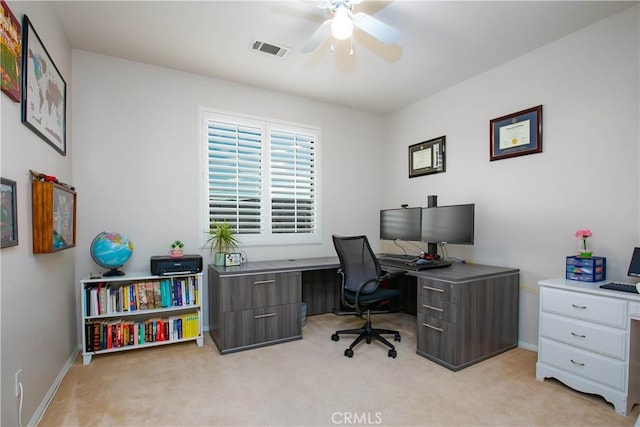 carpeted office featuring ceiling fan