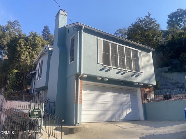 view of property exterior with a garage