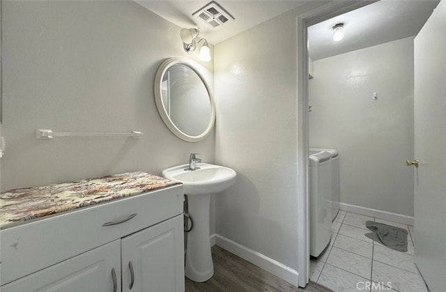 bathroom with washing machine and dryer