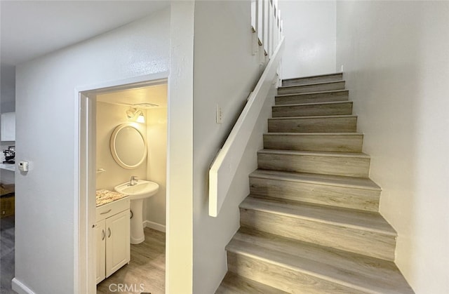 stairs with hardwood / wood-style flooring