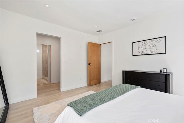 bedroom with light hardwood / wood-style floors