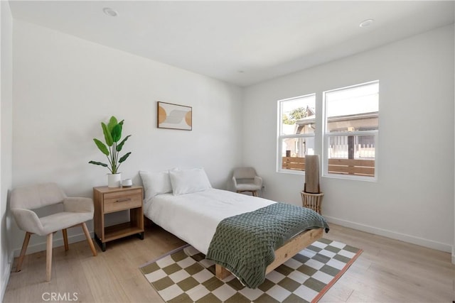 bedroom with light wood-type flooring