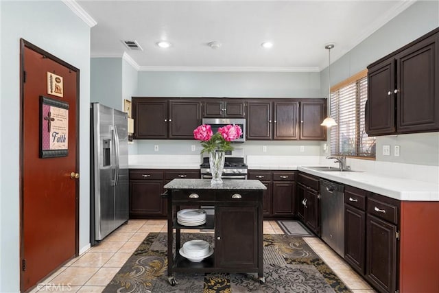 kitchen featuring a kitchen island, appliances with stainless steel finishes, sink, hanging light fixtures, and dark brown cabinetry