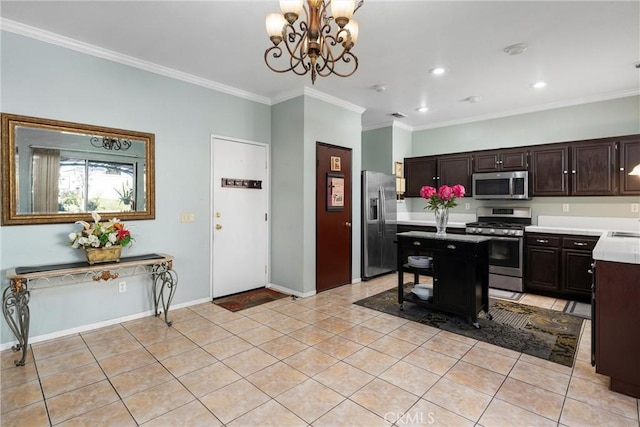 kitchen with ornamental molding, dark brown cabinets, light tile patterned flooring, and appliances with stainless steel finishes