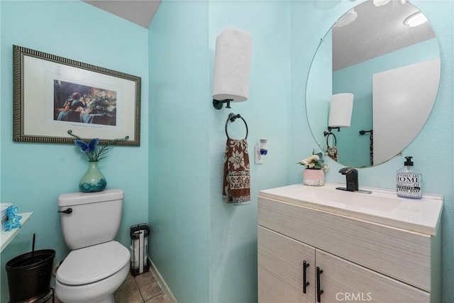 bathroom featuring vanity, toilet, and tile patterned flooring