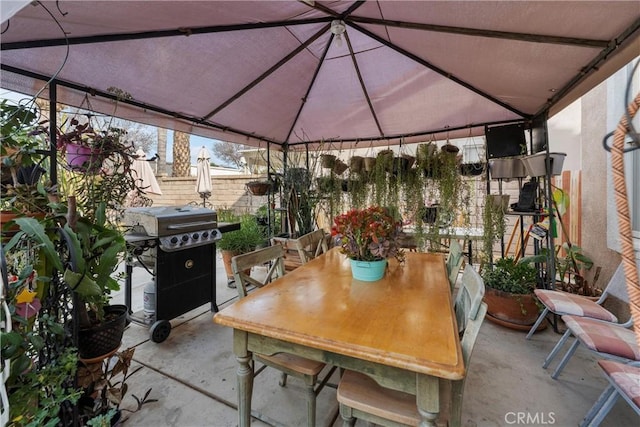 view of patio / terrace featuring a gazebo and grilling area