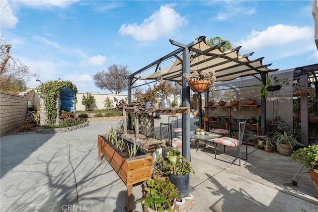 view of patio with an outdoor bar and a pergola