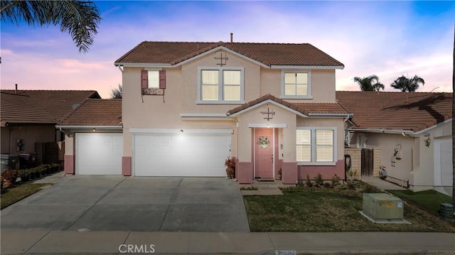 view of front of property with a garage