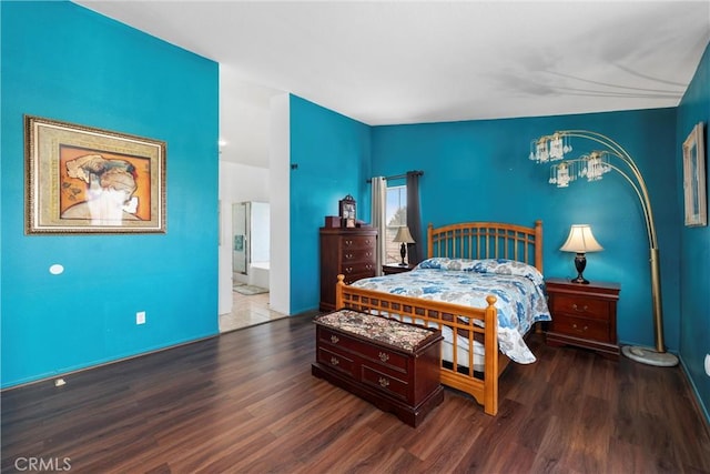 bedroom with dark wood-type flooring