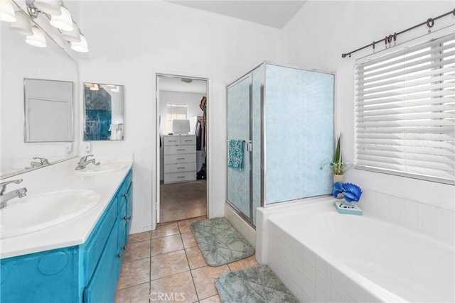 bathroom featuring vanity, tile patterned floors, and shower with separate bathtub