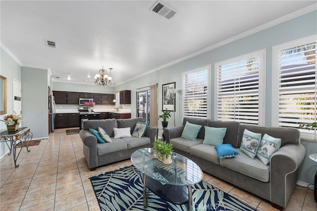 tiled living room featuring crown molding and a chandelier