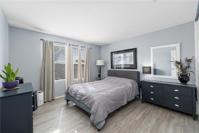 bedroom with light wood-type flooring