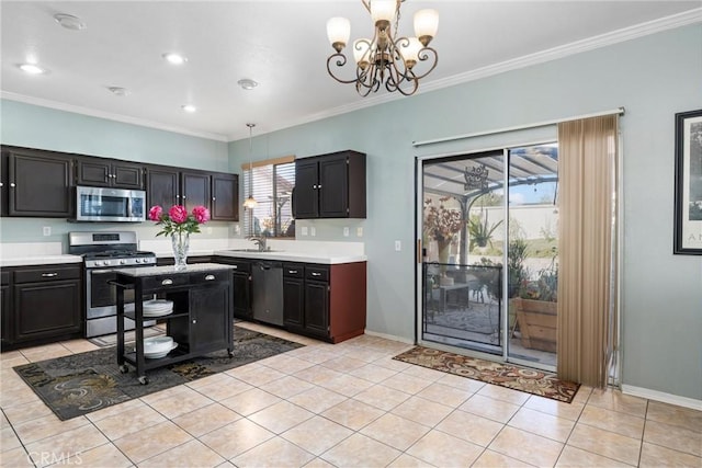 kitchen featuring sink, crown molding, light tile patterned floors, appliances with stainless steel finishes, and decorative light fixtures