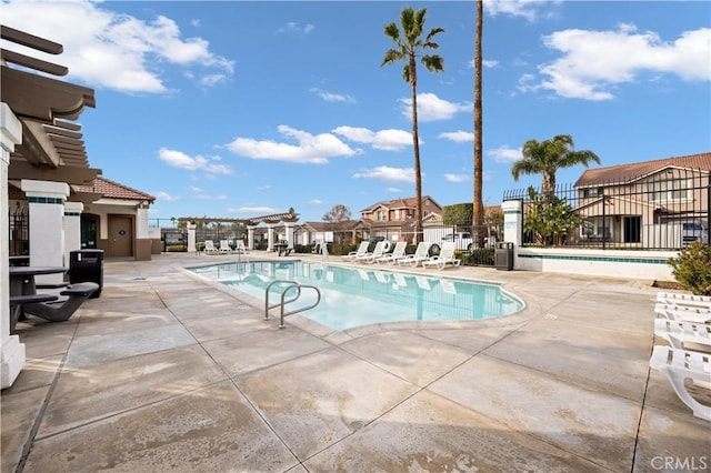 view of swimming pool with a patio area