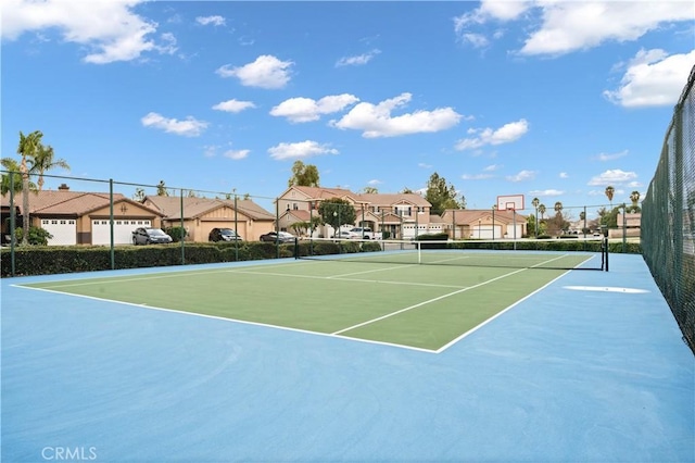 view of sport court with basketball hoop