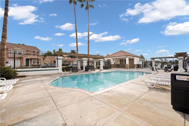 view of swimming pool with a patio and a pergola