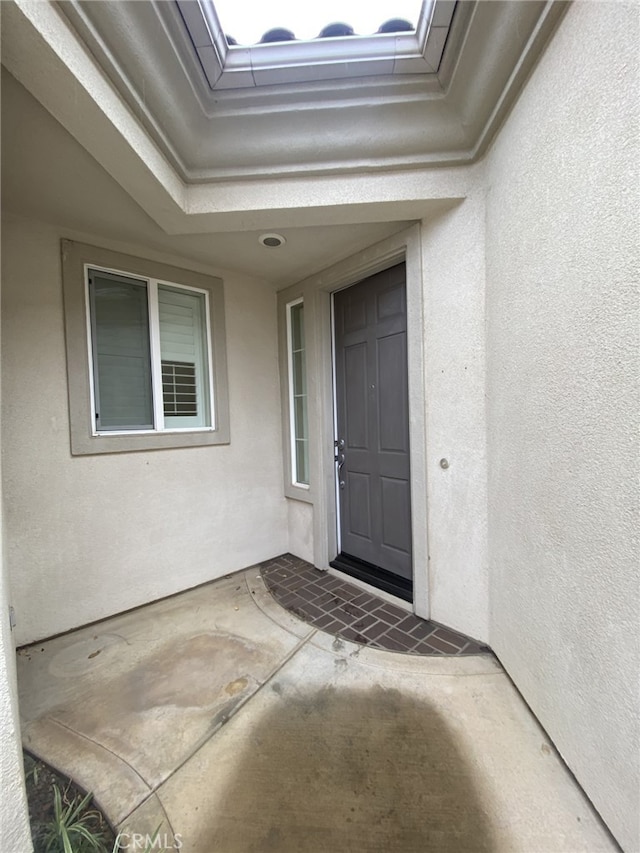 doorway to property with a patio