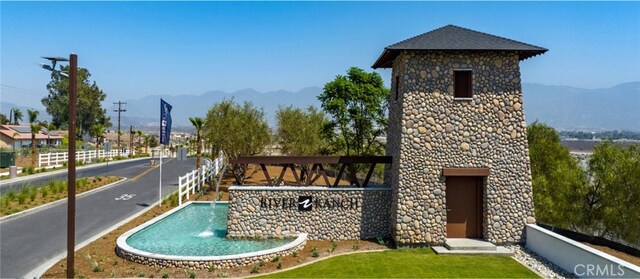 view of swimming pool with a mountain view