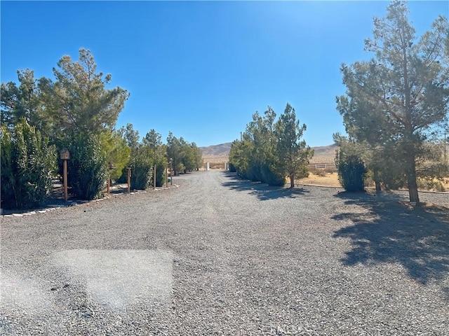 view of road featuring a mountain view and a rural view