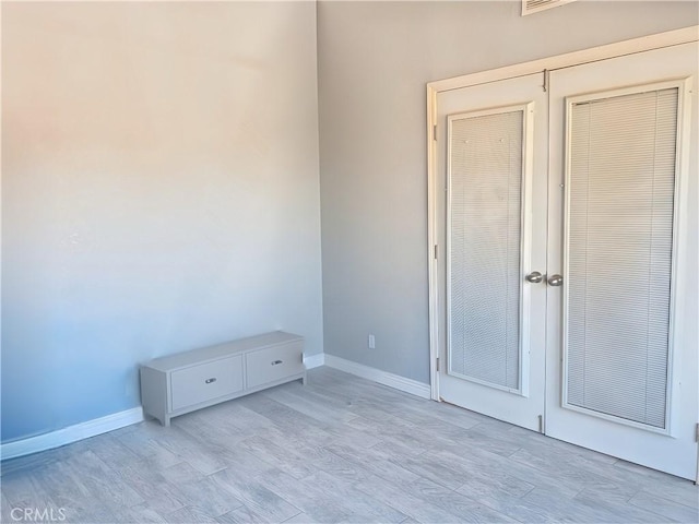 unfurnished bedroom with light wood-type flooring