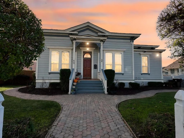 view of front of property with a lawn