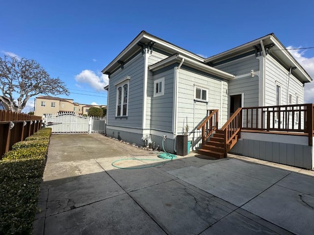 back of house with a patio