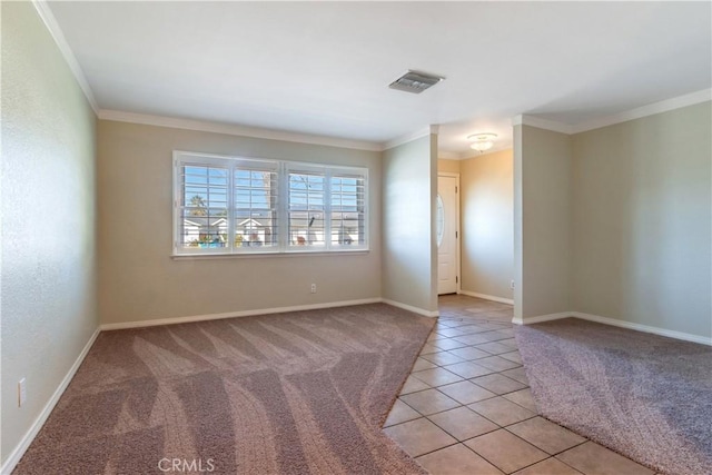 tiled empty room featuring ornamental molding