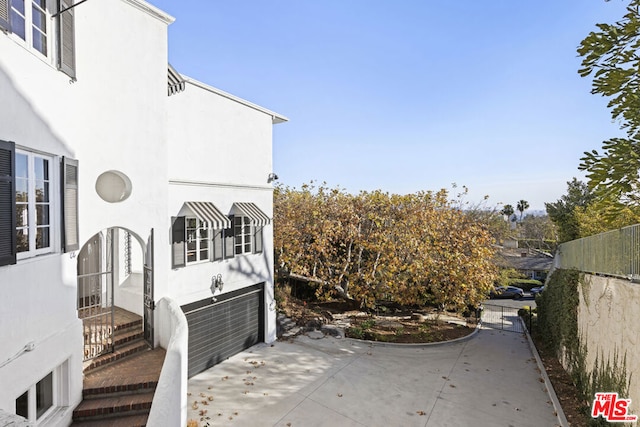 view of patio / terrace featuring a garage