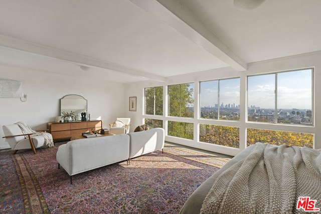 living room with beam ceiling