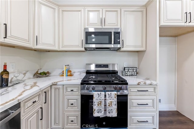 370 Auburn Dr, Lake Arrowhead, CA 92352 - kitchen featuring stainless steel appliances, light stone countertops, dark wood-style floors, and white cabinets