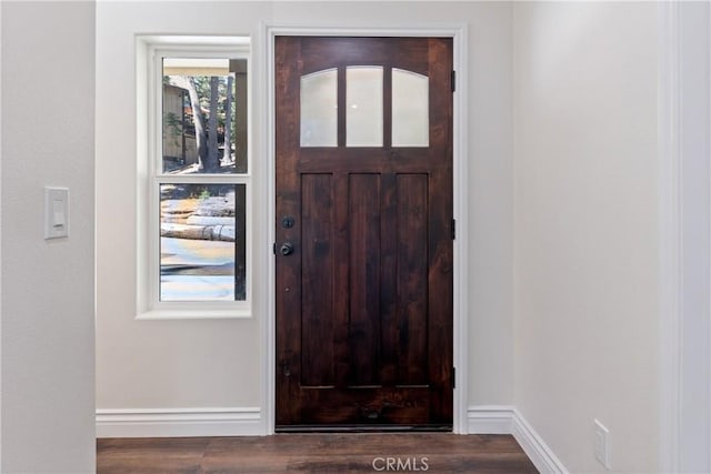 foyer entrance with dark hardwood / wood-style flooring