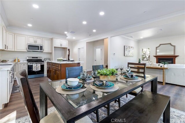 dining area with ornamental molding and dark wood-type flooring