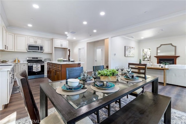 370 Auburn Dr, Lake Arrowhead, CA 92352 - dining room featuring dark wood finished floors, recessed lighting, ornamental molding, and a glass covered fireplace