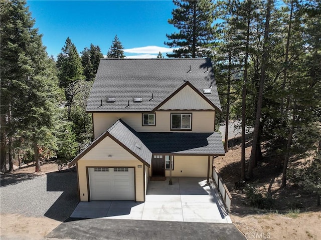 370 Auburn Dr, Lake Arrowhead, CA 92352 - view of front of property with roof with shingles, a garage, and concrete driveway