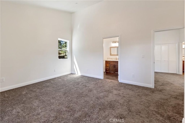 370 Auburn Dr, Lake Arrowhead, CA 92352 - unfurnished bedroom featuring dark colored carpet, a towering ceiling, and ensuite bathroom