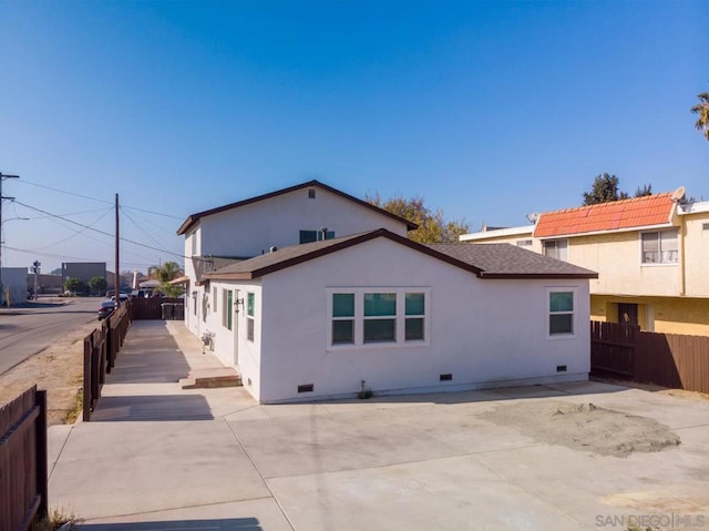 rear view of property featuring a patio