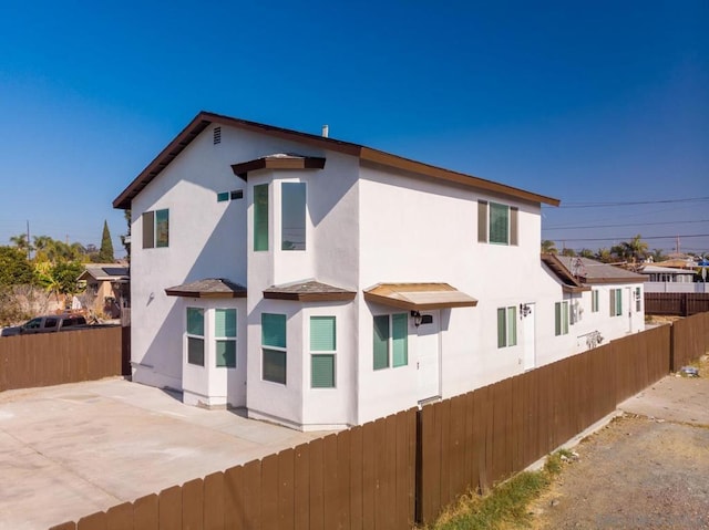 rear view of property with a patio area