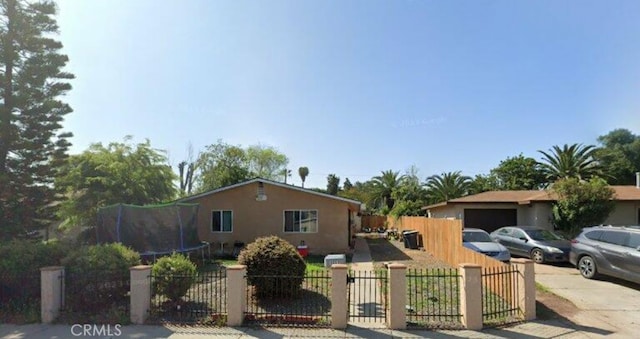 view of front of property with a trampoline