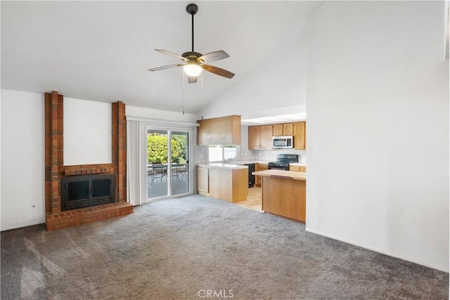 kitchen featuring ceiling fan, high vaulted ceiling, a brick fireplace, black range with electric cooktop, and light colored carpet