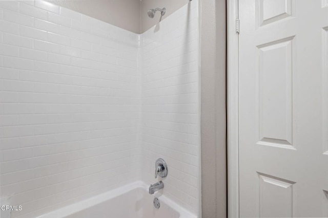 interior details featuring shower / tub combination