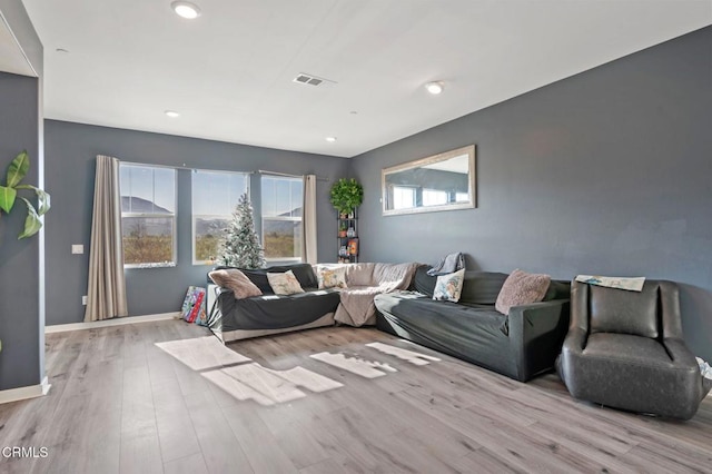 living room with light hardwood / wood-style flooring