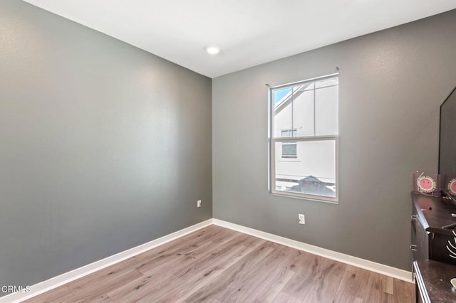 spare room featuring light hardwood / wood-style flooring