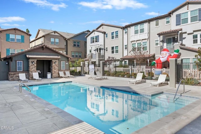 view of swimming pool featuring a patio area