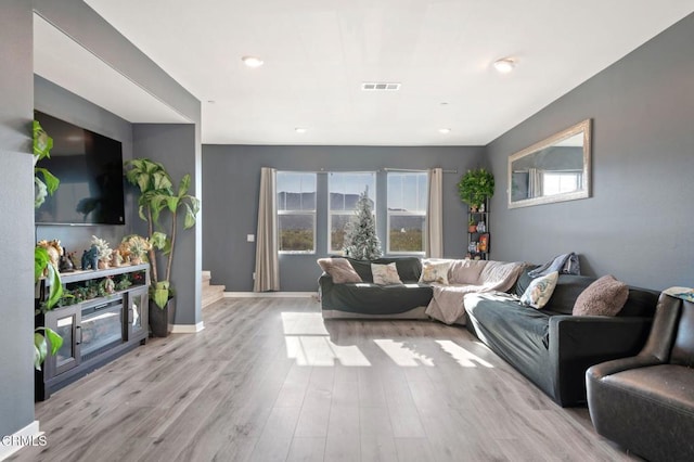 living room with light hardwood / wood-style floors